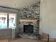 Living room with corner fireplace and stone surround at 94 Sterling Branch Loop # 94, Denver, NC 28037