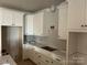 Modern kitchen with white cabinets and quartz countertops at 90 Silver Trace Ln # 90, Denver, NC 28037