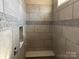 Neutral-toned shower with a built-in bench at 90 Silver Trace Ln # 90, Denver, NC 28037