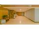 Spacious basement with tile floor, brick accent wall, and potential for various uses at 1405 Northcrest Dr, Albemarle, NC 28001