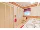 Well-lit bathroom with double sinks, framed mirror and storage space at 1405 Northcrest Dr, Albemarle, NC 28001