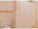Standard bathroom featuring a toilet, shower with curtain, and storage at 1405 Northcrest Dr, Albemarle, NC 28001