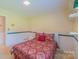 Bedroom featuring carpeted floors, a window that brings in great light and built-in shelves at 1405 Northcrest Dr, Albemarle, NC 28001