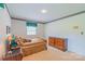 Bright bedroom boasts carpeted floors, wall trim and a large window that provides great light at 1405 Northcrest Dr, Albemarle, NC 28001