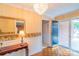 Inviting foyer with hardwood floors, decorative mirror, and views into other rooms at 1405 Northcrest Dr, Albemarle, NC 28001