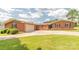 Well-maintained brick ranch home with a spacious driveway and a two-car garage at 1405 Northcrest Dr, Albemarle, NC 28001