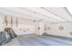 Spacious garage with painted walls, overhead storage, and ample room for vehicles and projects at 1405 Northcrest Dr, Albemarle, NC 28001