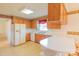Traditional kitchen features wood cabinets, white countertops, and appliances at 1405 Northcrest Dr, Albemarle, NC 28001
