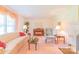 Cozy living room with soft furnishings, piano, and fireplace at 1405 Northcrest Dr, Albemarle, NC 28001