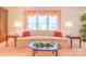 Inviting living room with plush sofa, decorative pillows, and ample natural light at 1405 Northcrest Dr, Albemarle, NC 28001