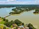 Aerial view of lakefront property and neighborhood at 418 Sebring Ct, Belmont, NC 28012