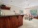 L-shaped basement bar with seating area at 418 Sebring Ct, Belmont, NC 28012