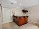 Basement wet bar with granite countertop and wood cabinetry at 418 Sebring Ct, Belmont, NC 28012