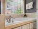 Bathroom with a jetted tub, updated fixtures and tile flooring at 418 Sebring Ct, Belmont, NC 28012