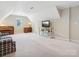 Spacious bonus room with a piano and TV at 418 Sebring Ct, Belmont, NC 28012