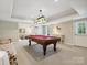 Basement game room with pool table and seating at 418 Sebring Ct, Belmont, NC 28012