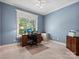 Bright home office features built-in desk and window views at 418 Sebring Ct, Belmont, NC 28012