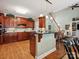 Kitchen features a breakfast bar, granite countertops, stainless steel appliances, and hardwood floors at 418 Sebring Ct, Belmont, NC 28012