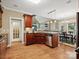 Open kitchen with an island, granite countertops, stainless steel appliances, and hardwood floors at 418 Sebring Ct, Belmont, NC 28012