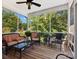 Relaxing screened porch with wicker furniture at 418 Sebring Ct, Belmont, NC 28012