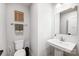 Simple and clean bathroom with white vanity and fixtures at 14949 Holbrooks Rd, Huntersville, NC 28078