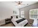 Bright bedroom with double windows, ceiling fan, and ample space at 14949 Holbrooks Rd, Huntersville, NC 28078