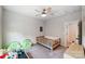 bedroom with twin daybed, ceiling fan and bookshelf at 14949 Holbrooks Rd, Huntersville, NC 28078