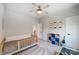 bedroom with twin daybed, ceiling fan and toy storage at 14949 Holbrooks Rd, Huntersville, NC 28078