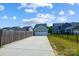 Attached two-car garage with concrete driveway at 14949 Holbrooks Rd, Huntersville, NC 28078