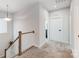 Upstairs hallway with neutral walls and carpet at 14949 Holbrooks Rd, Huntersville, NC 28078