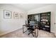 Home office with built-in shelving and natural light at 14949 Holbrooks Rd, Huntersville, NC 28078