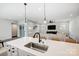 Kitchen island with sink, features a clean and modern design at 14949 Holbrooks Rd, Huntersville, NC 28078