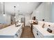 Modern kitchen with white cabinets and large island at 14949 Holbrooks Rd, Huntersville, NC 28078