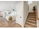 Staircase with carpeted steps and white railing at 14949 Holbrooks Rd, Huntersville, NC 28078