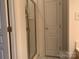 Neutral bathroom featuring a walk-in shower with glass door at 19307 Beaufain St, Cornelius, NC 28031