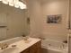 Bright bathroom showcasing dual sinks and soaking tub at 19307 Beaufain St, Cornelius, NC 28031