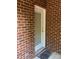 Exterior shot of white door with brick surround at 19307 Beaufain St, Cornelius, NC 28031