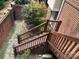 The wooden stairs lead from the brick patio to the upper level of the property at 19307 Beaufain St, Cornelius, NC 28031