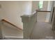 An indoor staircase with wooden banisters leads to the second floor of the home at 19307 Beaufain St, Cornelius, NC 28031
