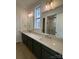 Double vanity bathroom with dark cabinets and quartz countertop at 609 Hops Aly, Fort Mill, SC 29715