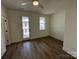 Bright bedroom with hardwood floors and access to a private balcony at 609 Hops Aly, Fort Mill, SC 29715