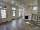 Bright living room featuring a fireplace and built-in shelving at 609 Hops Aly, Fort Mill, SC 29715