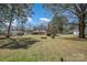 This large property includes an outbuilding, fire pit, and plenty of yard space at 1206 Mineral Springs Rd, Charlotte, NC 28262