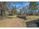 This large lot features several outbuildings and plenty of firewood at 1206 Mineral Springs Rd, Charlotte, NC 28262