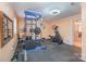 This basement features a full home gym with weight machines and an elliptical at 1206 Mineral Springs Rd, Charlotte, NC 28262