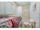 This bathroom features a washer/dryer, bathtub and shower at 1206 Mineral Springs Rd, Charlotte, NC 28262