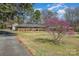 Traditional brick home with a long driveway and mature landscaping at 1206 Mineral Springs Rd, Charlotte, NC 28262