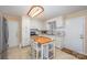 Charming kitchen with white cabinets, modern appliances, and an island with seating at 1206 Mineral Springs Rd, Charlotte, NC 28262