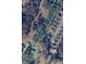 Aerial parcel view of the property surrounded by mature trees and neighboring homes at 1206 Mineral Springs Rd, Charlotte, NC 28262