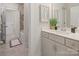 A modern bathroom featuring a sleek vanity and a shower with neutral tile surround at 4861 Blanchard Way, Charlotte, NC 28226